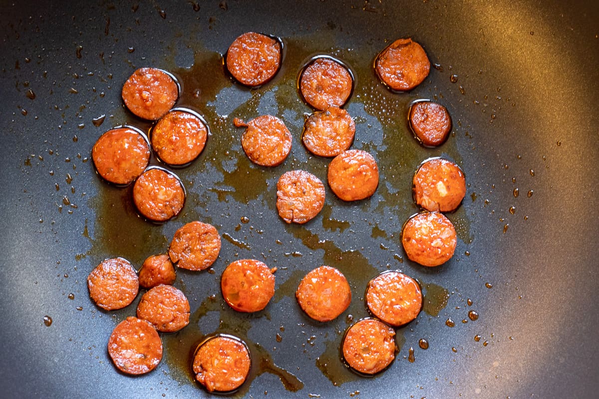 browning the chorizo in a pan until crisp