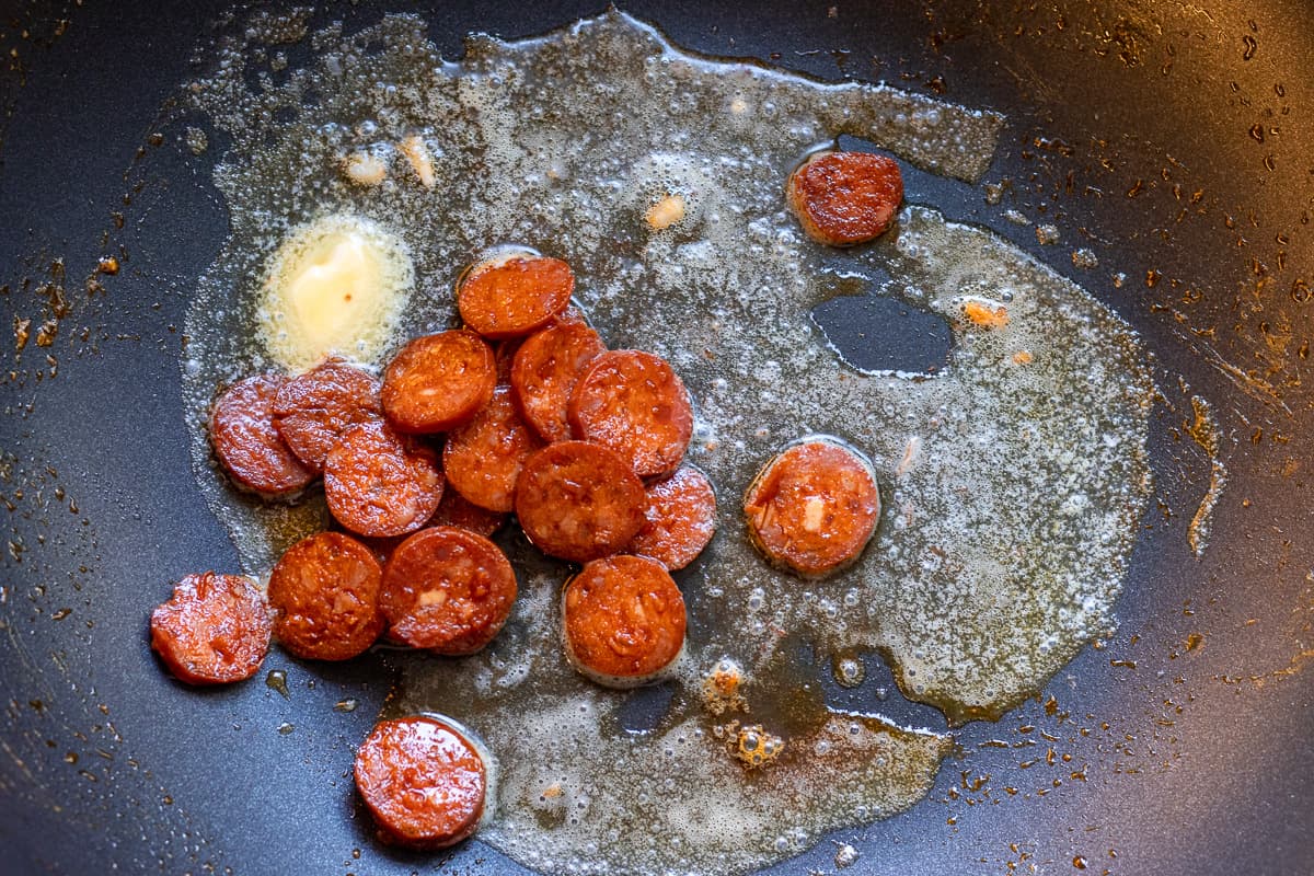 return the chorizo back to the pan with some butter
