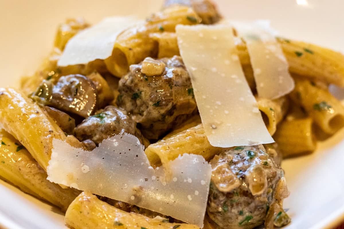 spicy and creamy Swedish meatball pasta served with shaved parmesan