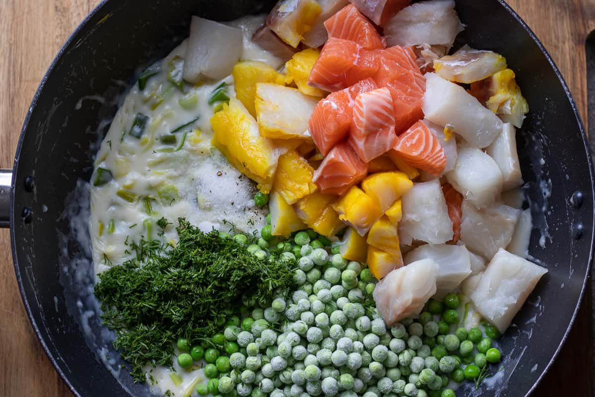 fish mixture is added to the creamy leek sauce