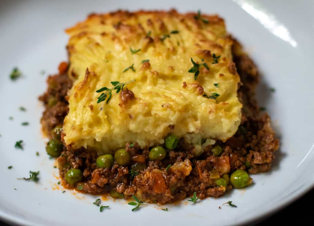 a portion of traditional cottage pie served on a plate