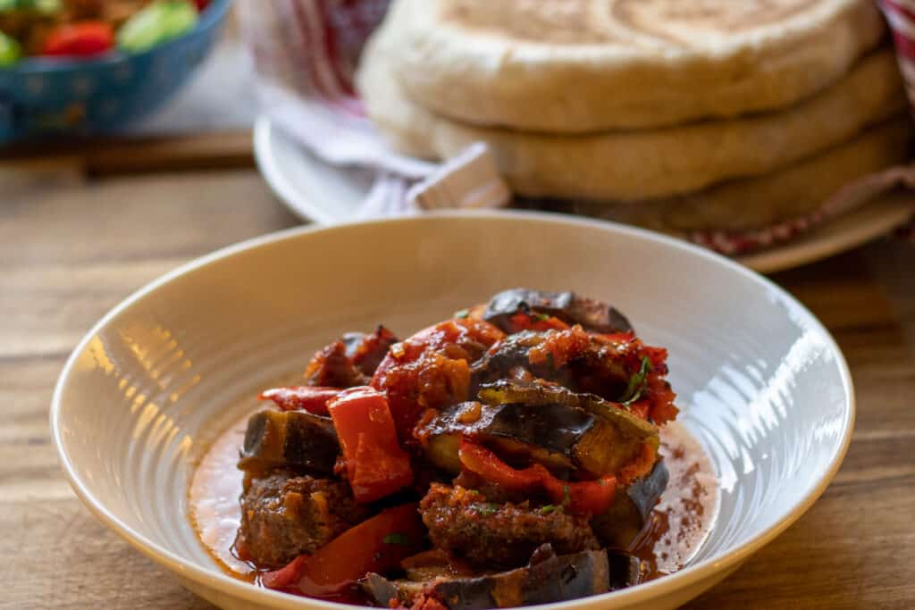 patrician kebabi eggplant kebab served with bazlama in a plate