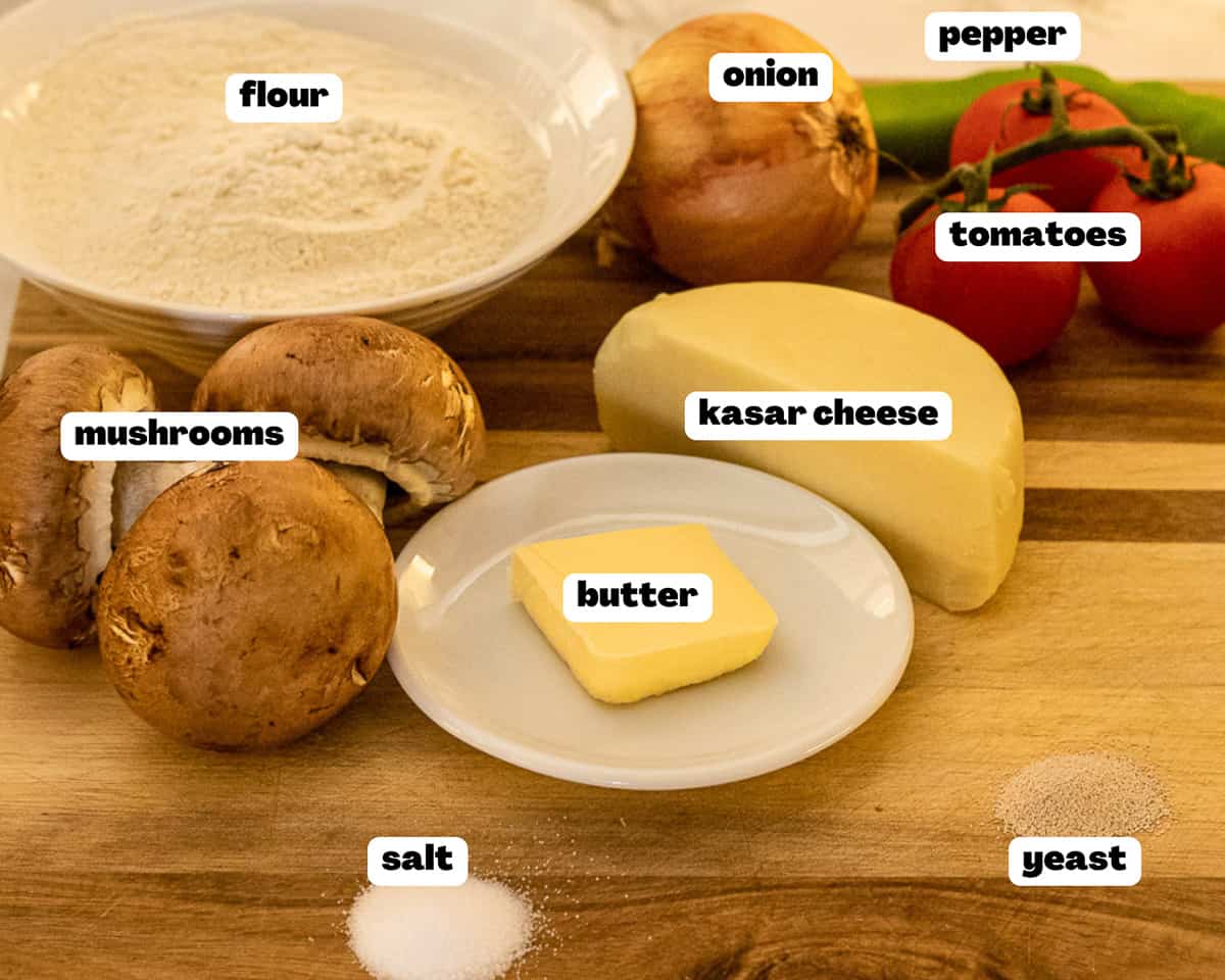 Labelled picture of ingredients for mushroom and Cheese Pide