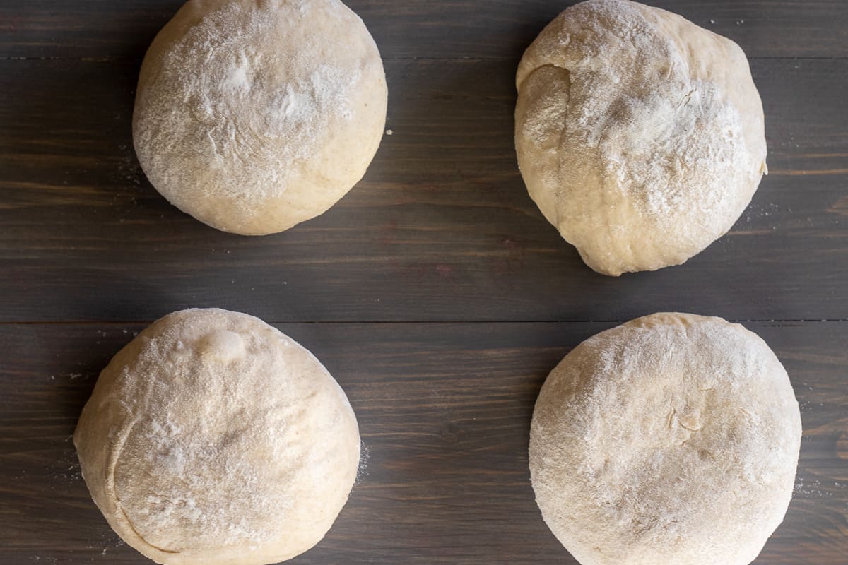 the dough is divided into 4 equal pieces