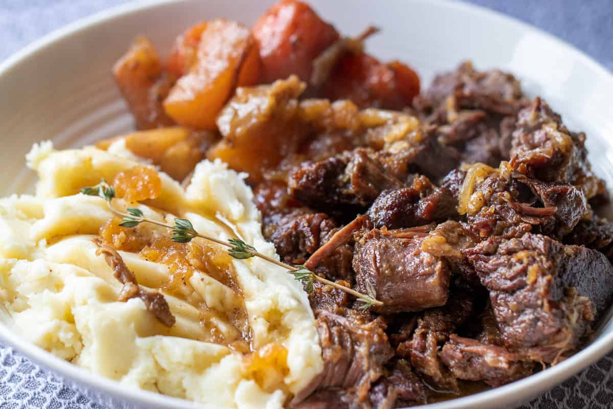 Chuck roast served with mashed potatoes 