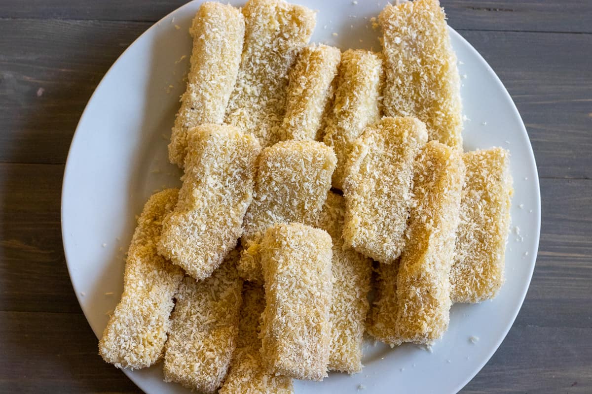 fish sticks are all covered with flour, egg and breadcrumbs 
