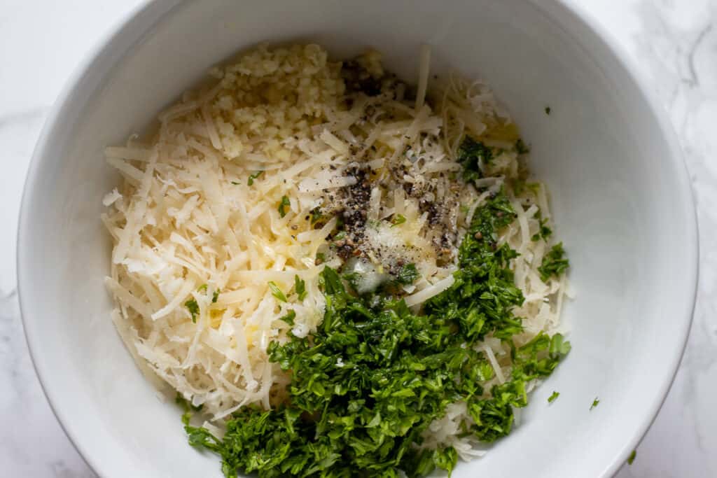 place the panko, parmesan, lemon zest, herbs and seasoning in a bowl