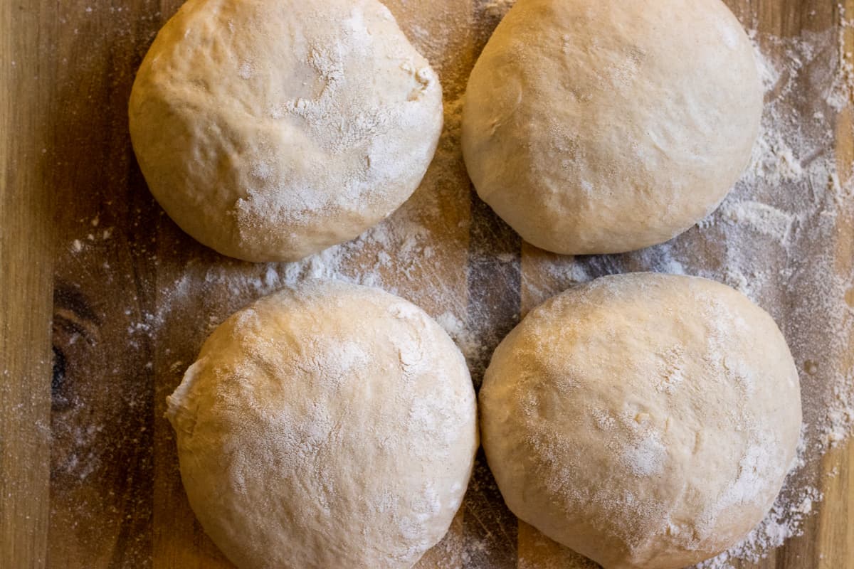 the dough is shaped into 4 equal balls