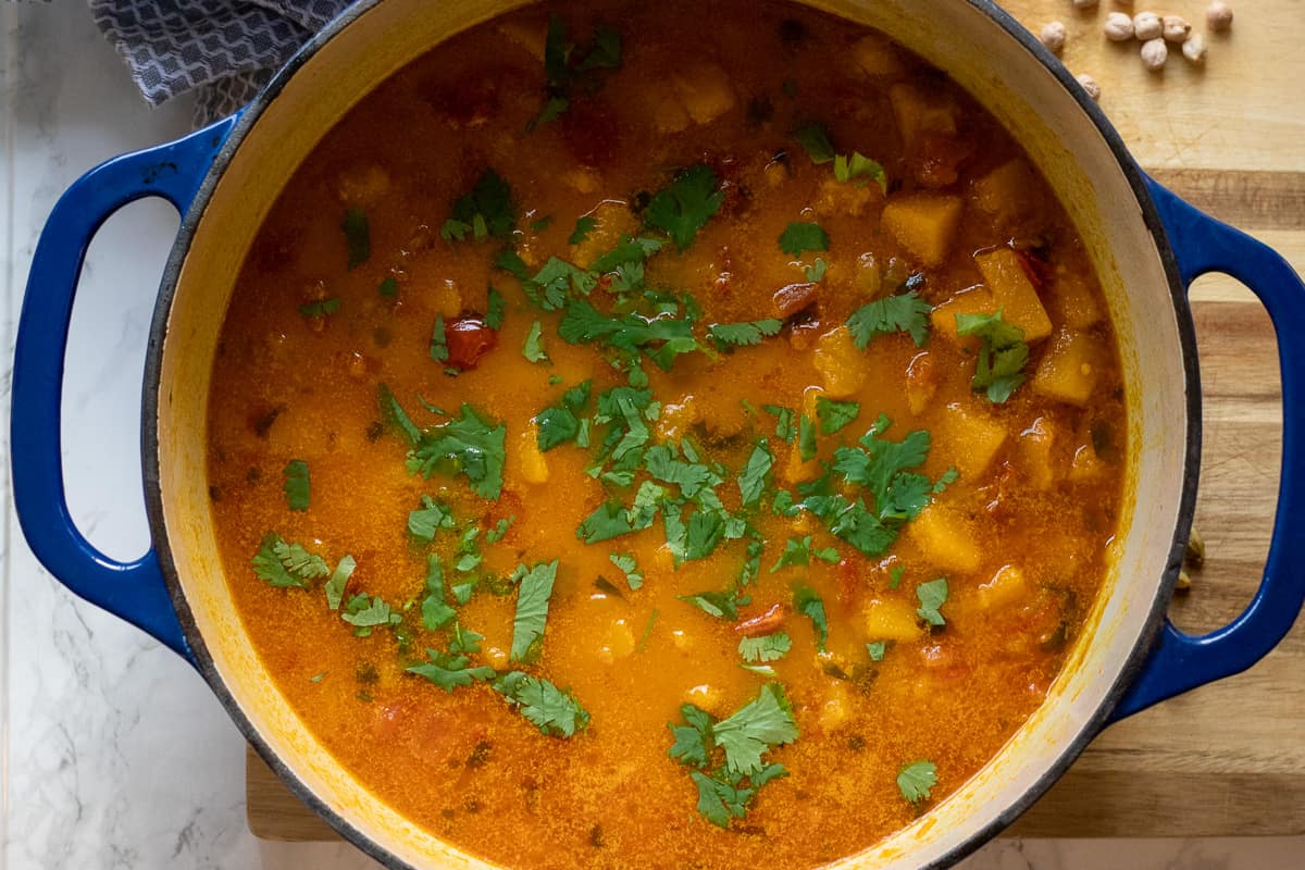butternut squash chickpea curry cooked in a Dutch oven 