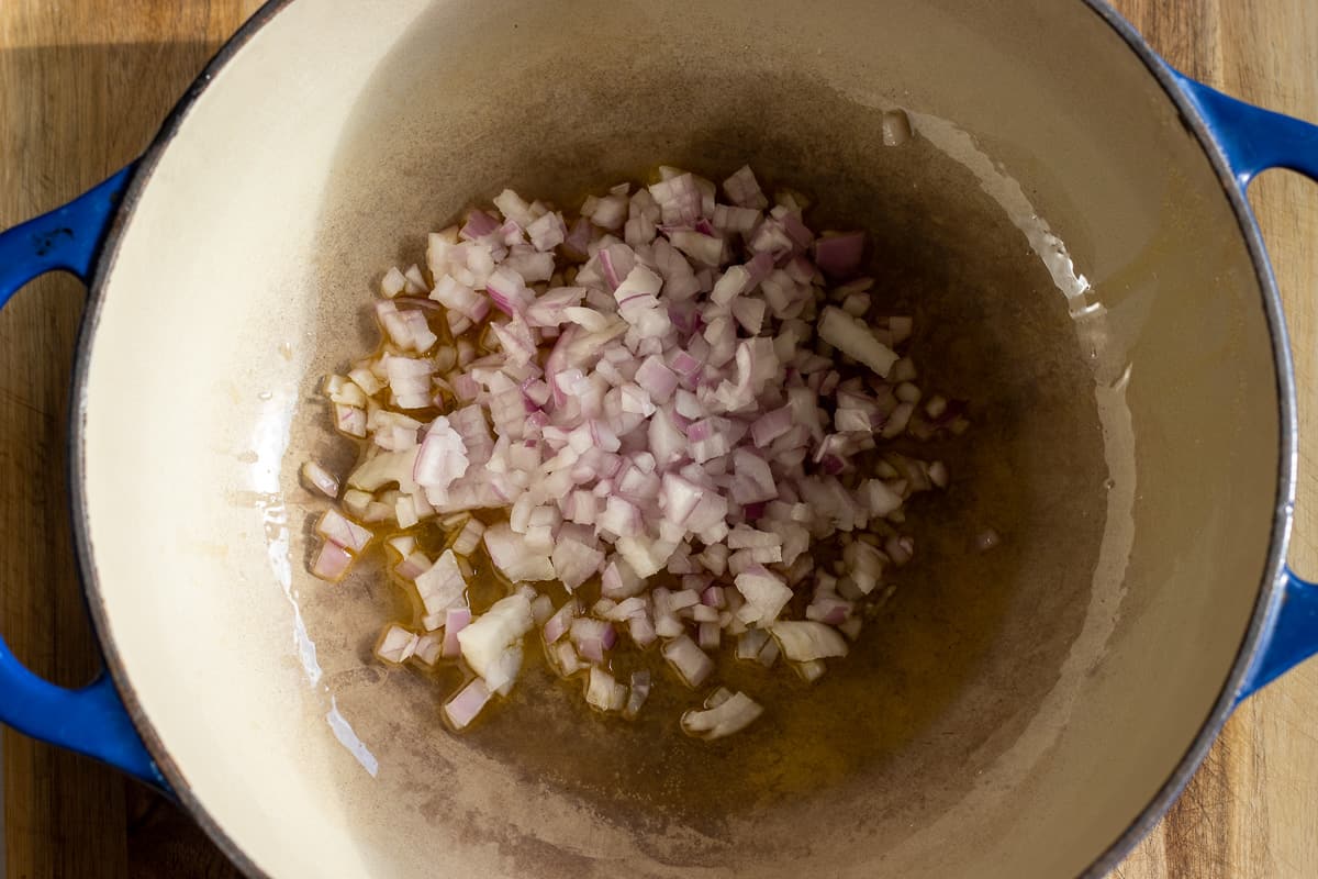 Sautéing the onions with ghee in a Dutch oven