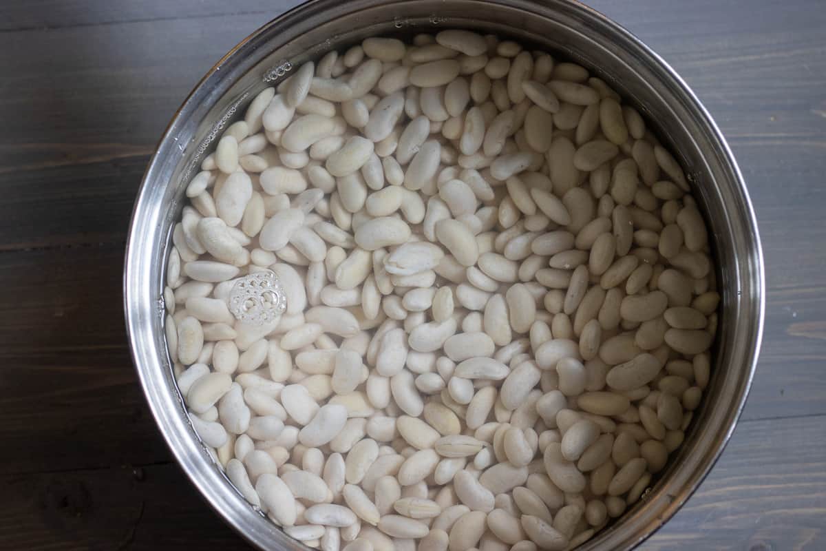 cooking soaked white beans with plenty of water