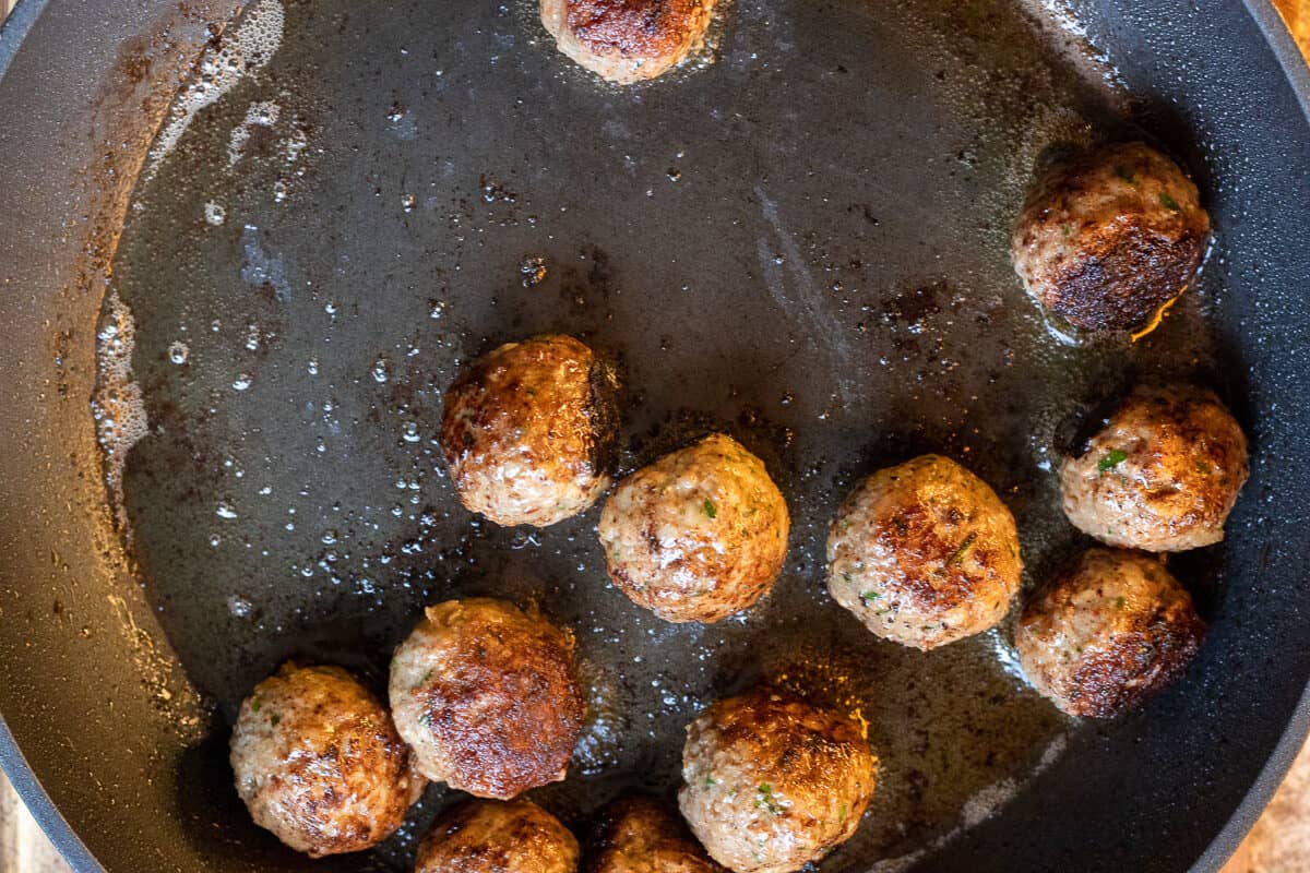 Sautéing the meatballs with oil
