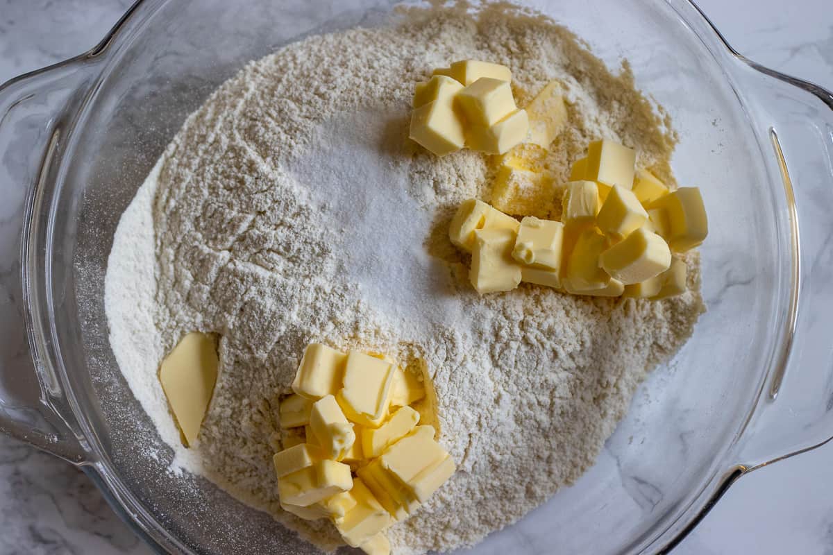 The flour and cubed butter are in a bowl