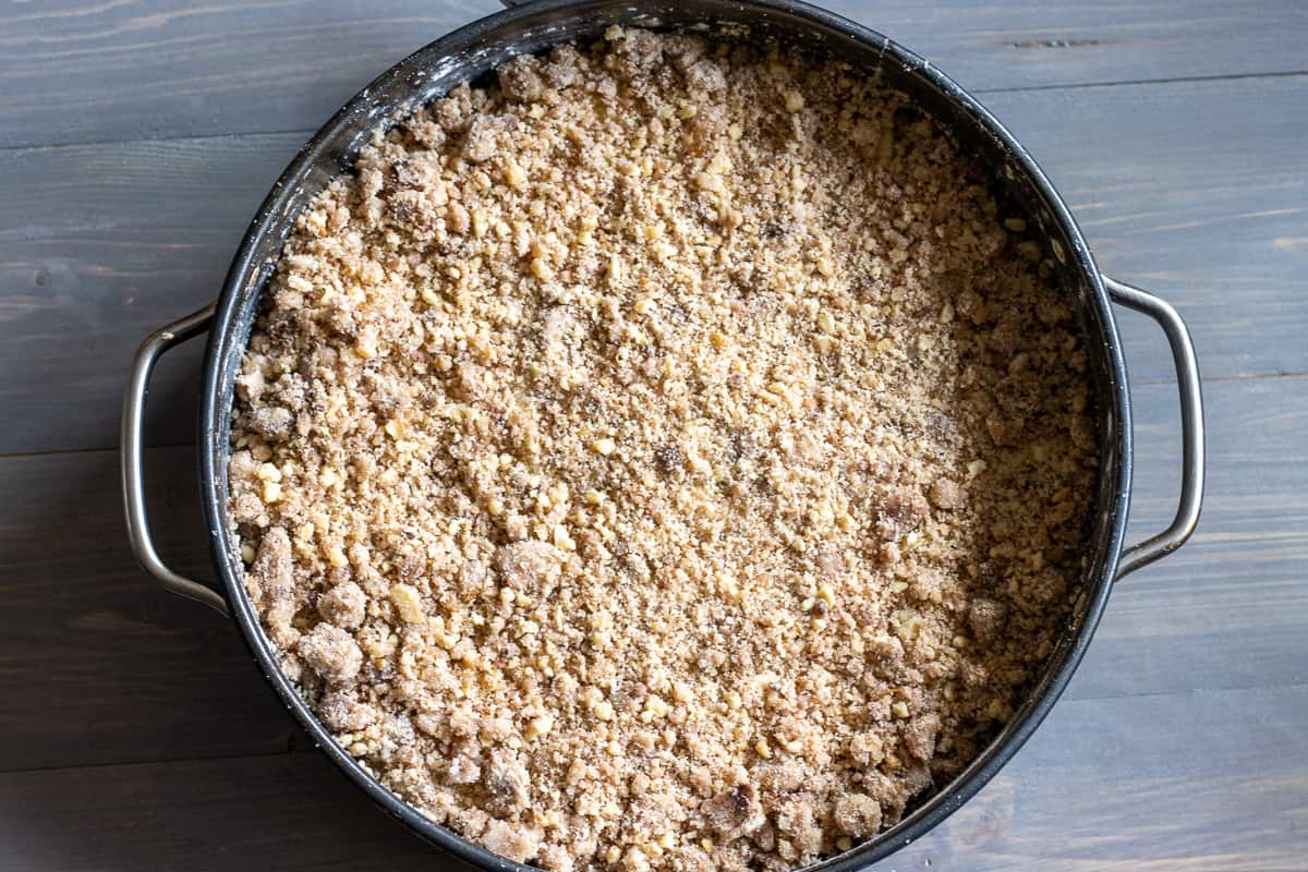 apples are covered with crumble mixture 