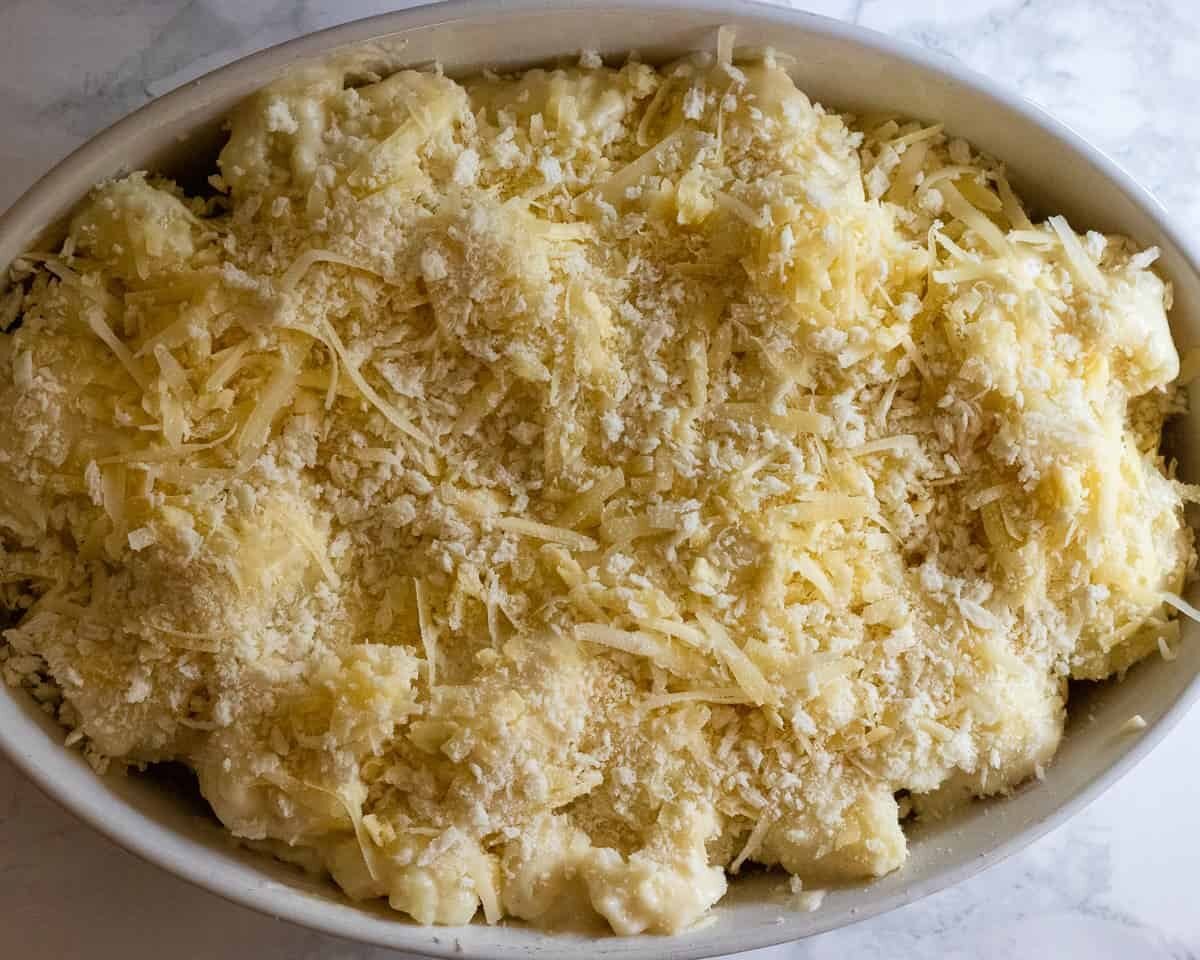 cheese and breadcrumbs are sprinkled on top of cauliflower