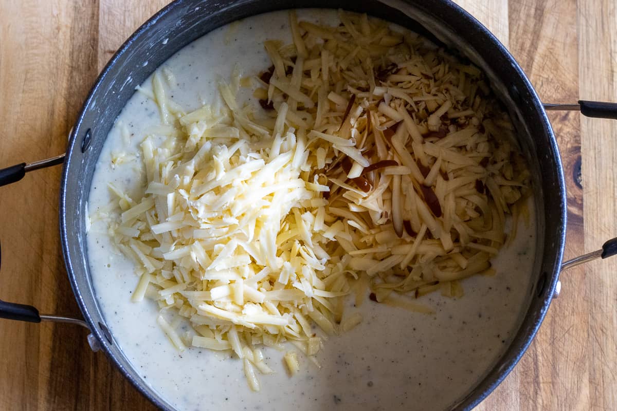 smoked gouda and cheddar are added to the sauce