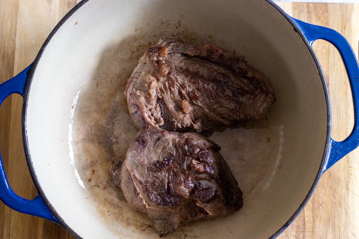 browning the beef cheeks in a dutch oven