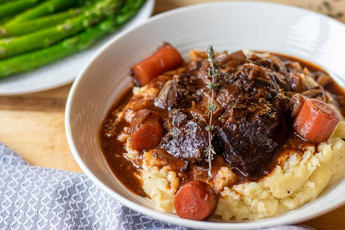 braised beef cheeks served with asparagus
