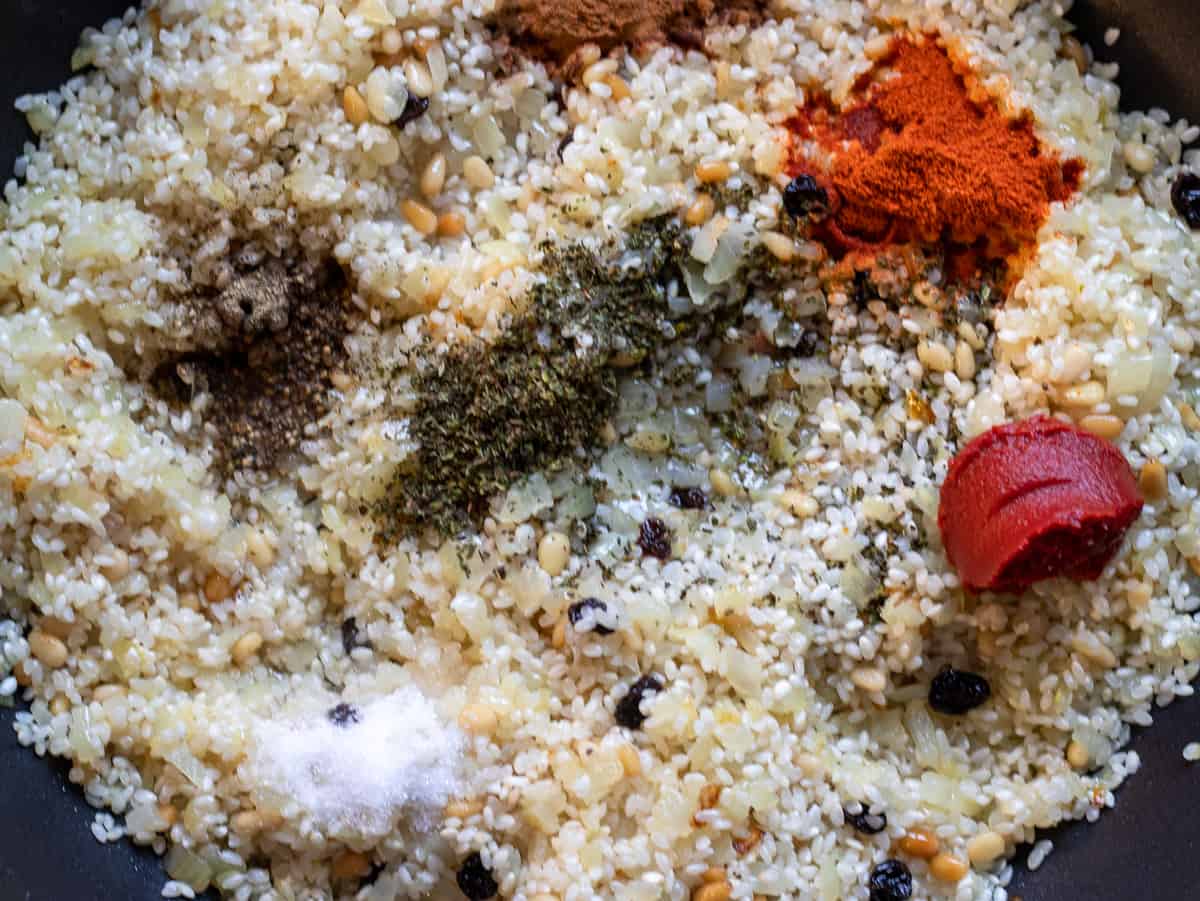 The spices, tomato paste and herbs are added to the rice filling
