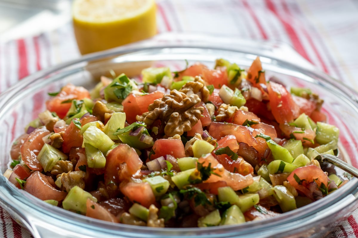 Turkish tomato walnut salad - Gavurdagi Salatasi served in a glass plate