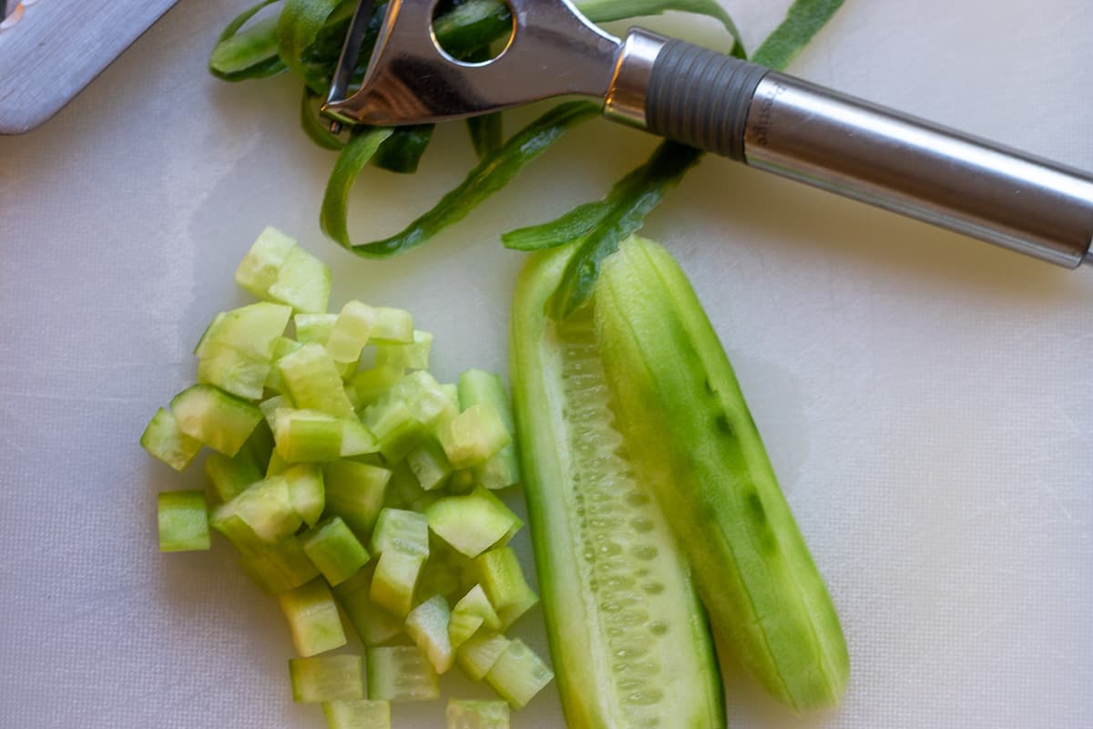 the cucumber is peeled and cut in cubes