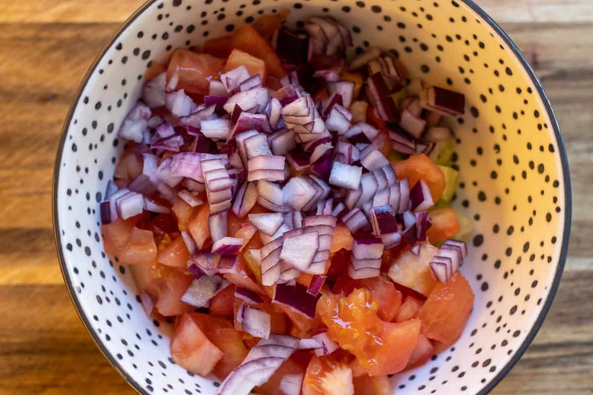 diced onions are added to the bowl
