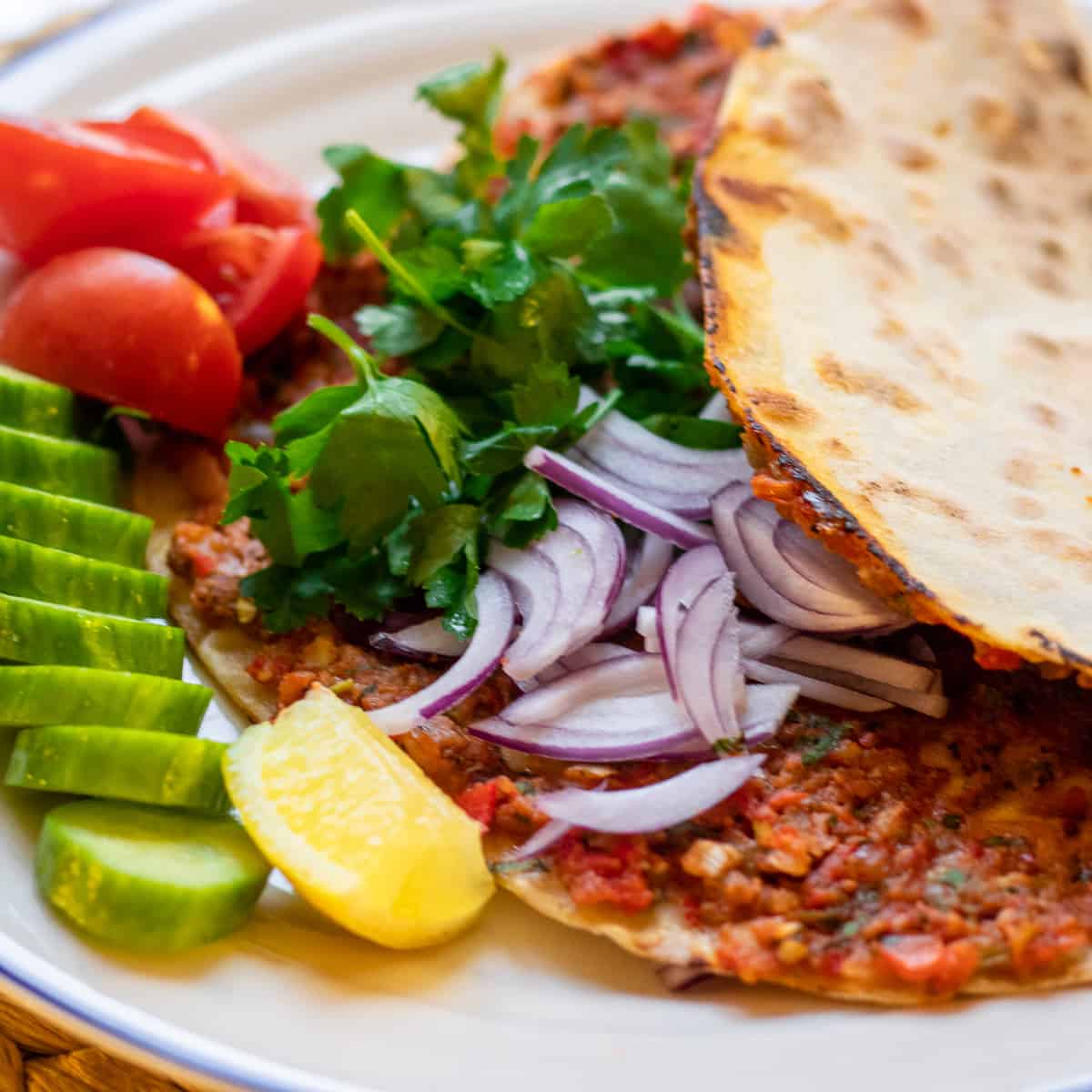 Turkish lahmacun served with salad