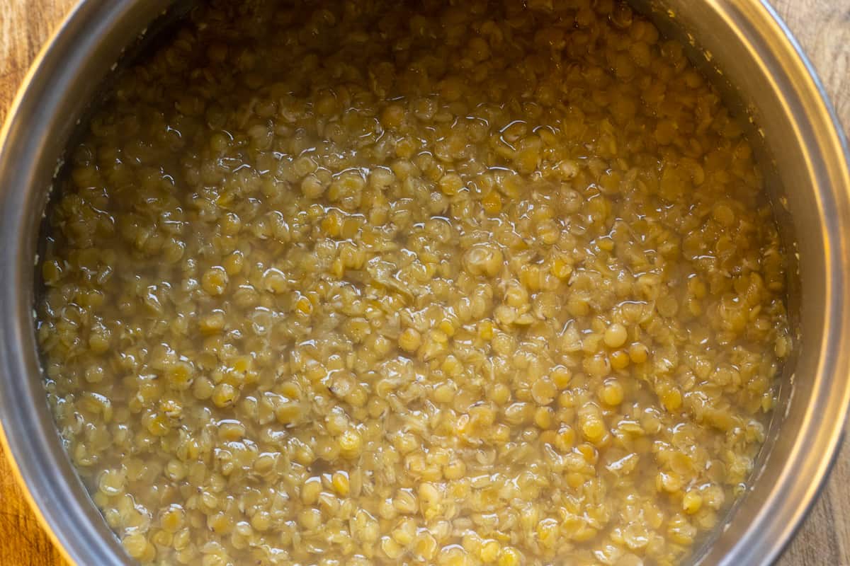 Lentils cooked with water in a pan