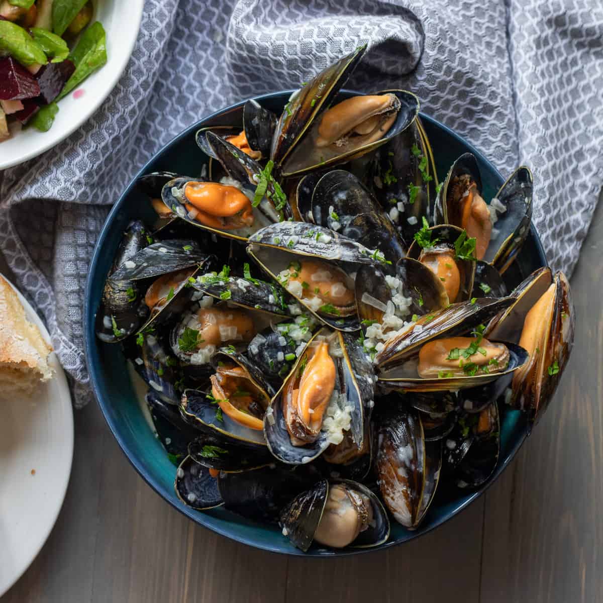 classic French Mussel in white wine sauce served with salad