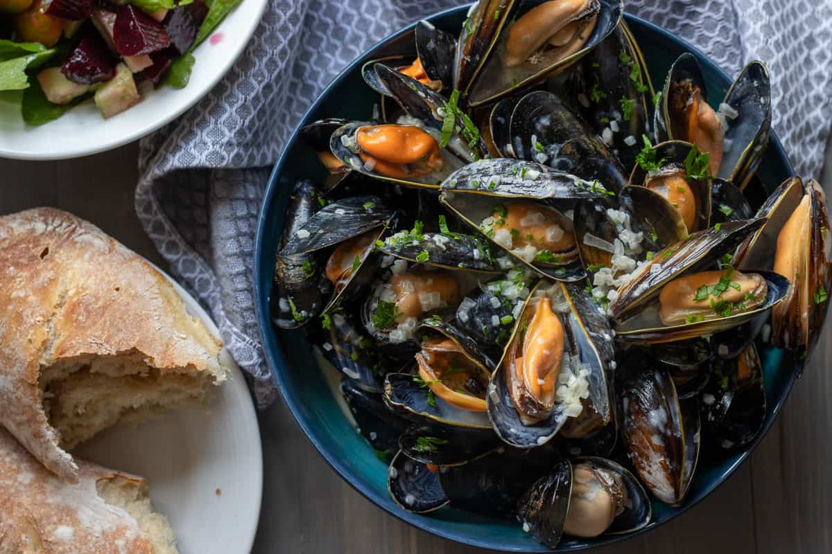 French mussels served with crusty bread and salad