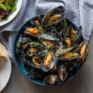classic French Mussel in white wine sauce served with salad