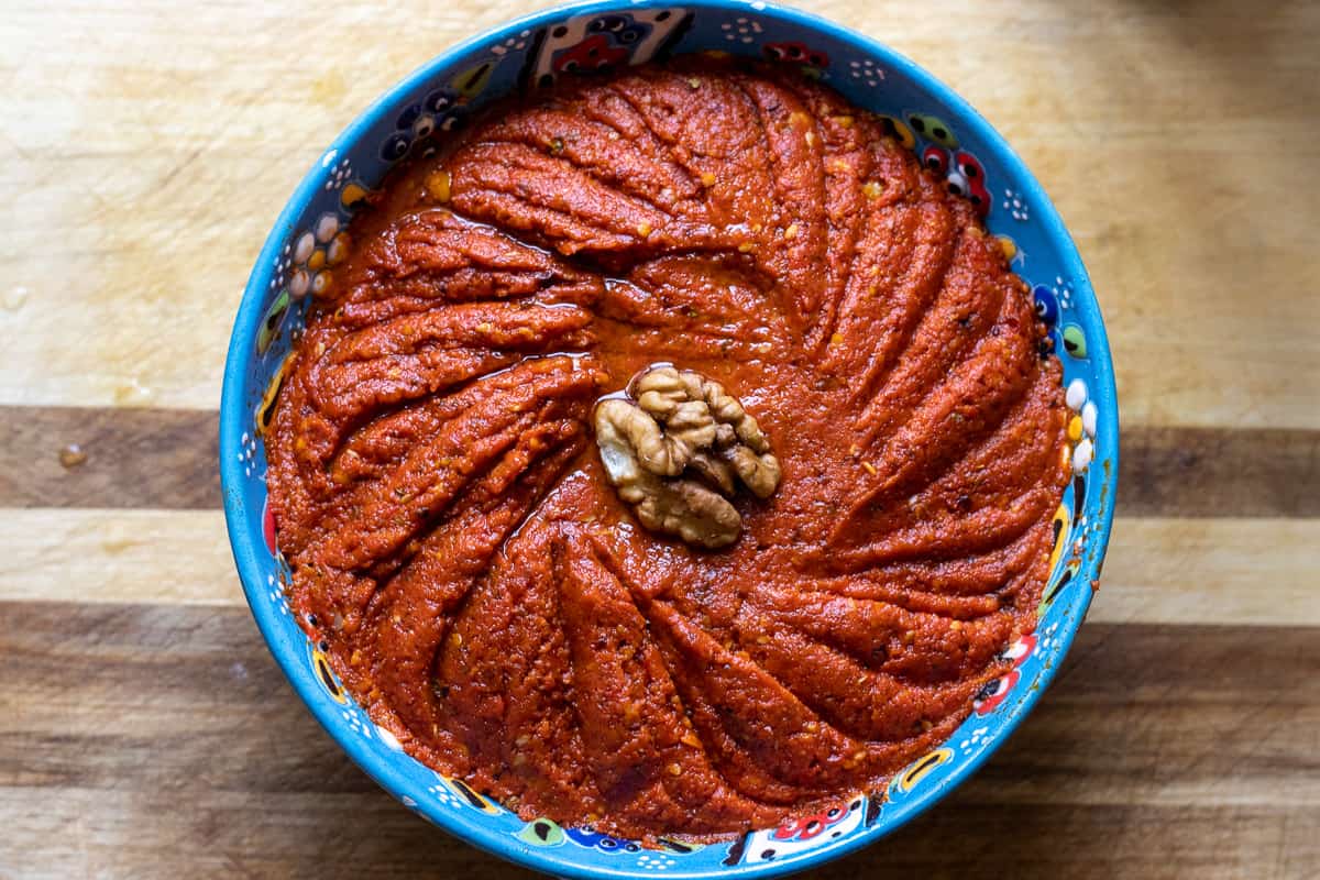 muhammara  - Acuka (red pepper dip) is served in a bowl as a mezze