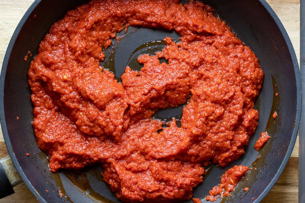 blitzed roasted red peppers are added to tomato paste and pepper paste