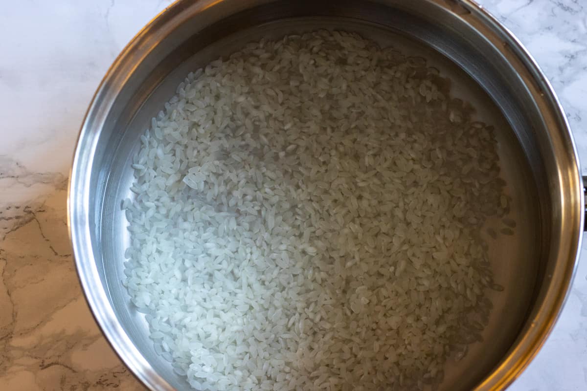 the rice is placed in a pan with water