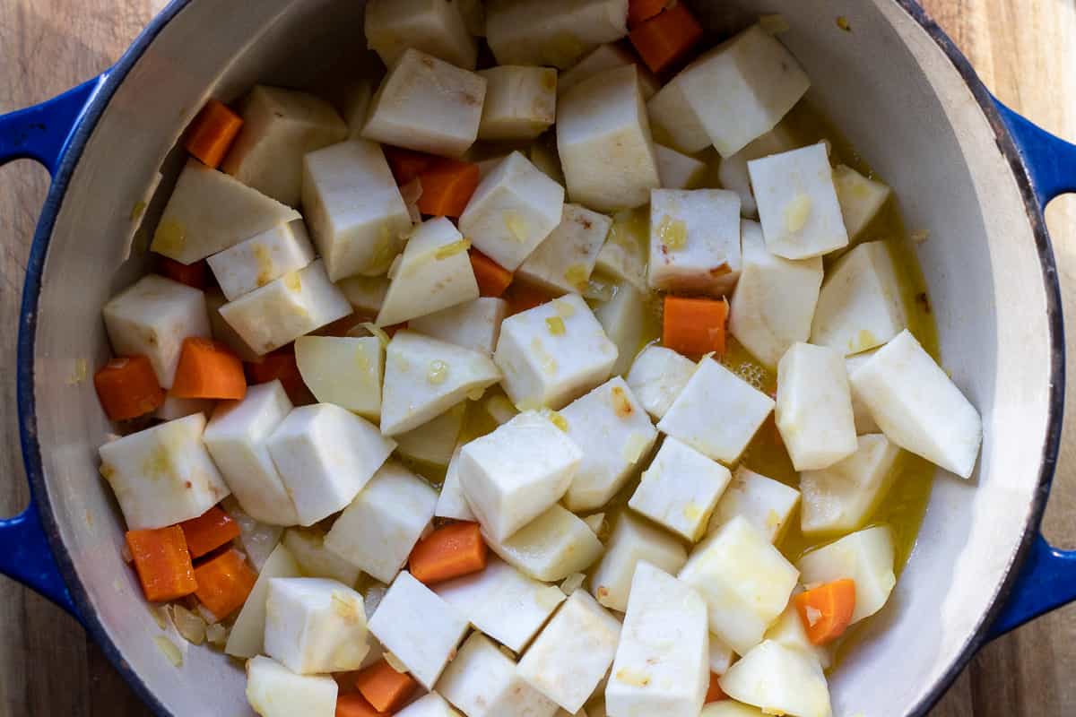 diced celeriac is added to the pan along with orange and lemon juice, and seasoning.