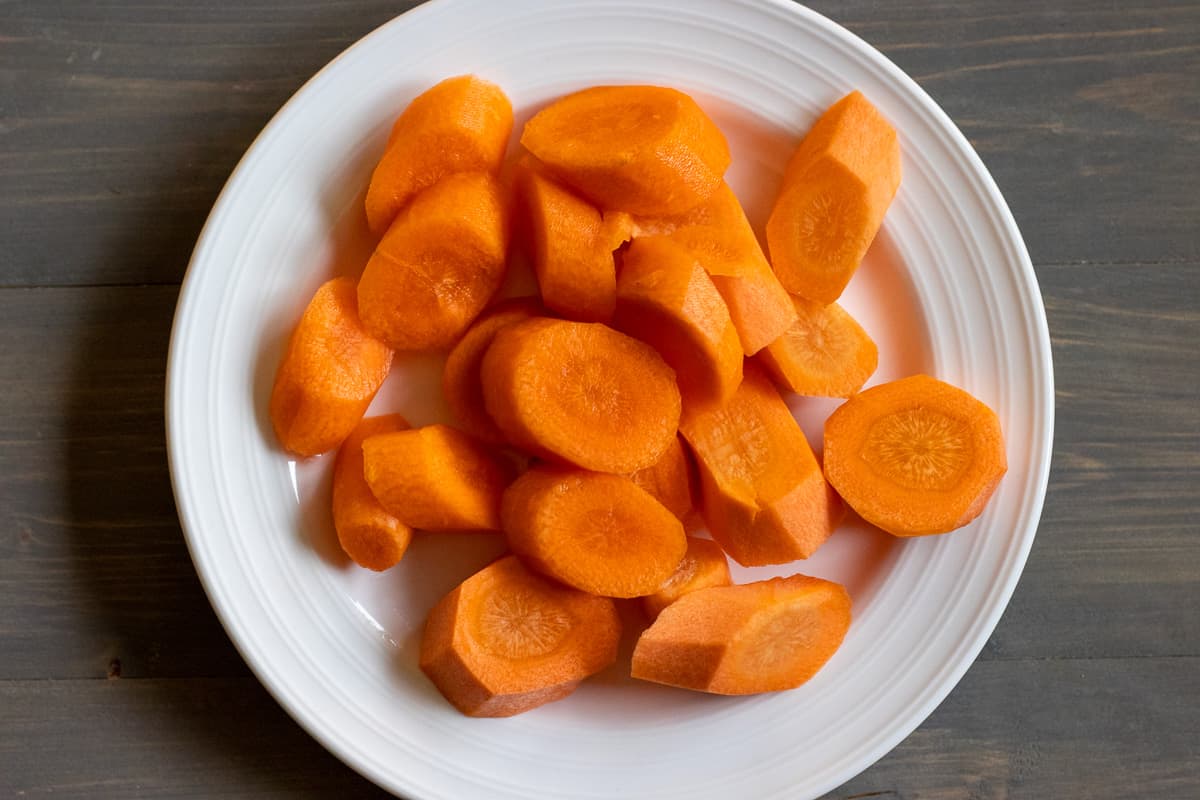 peeled and sliced carrots placed on a plate
