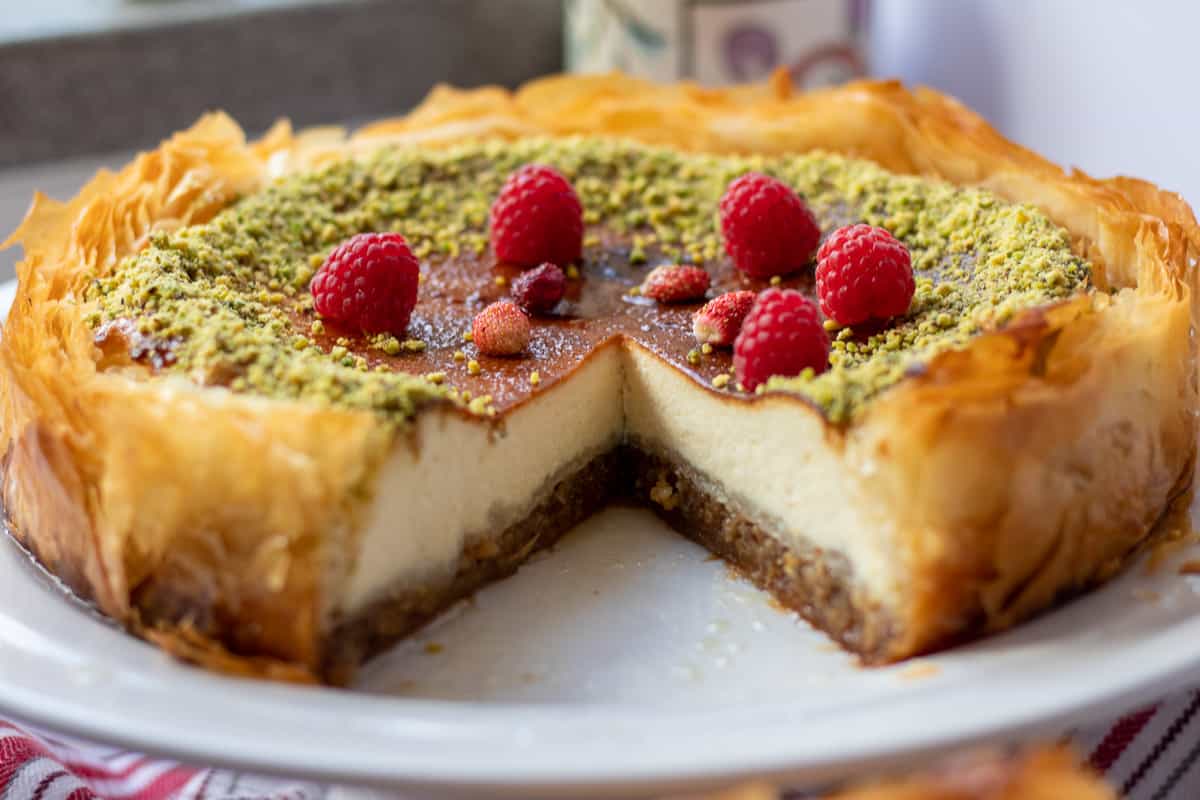 a slice of baklava cheesecake is removed