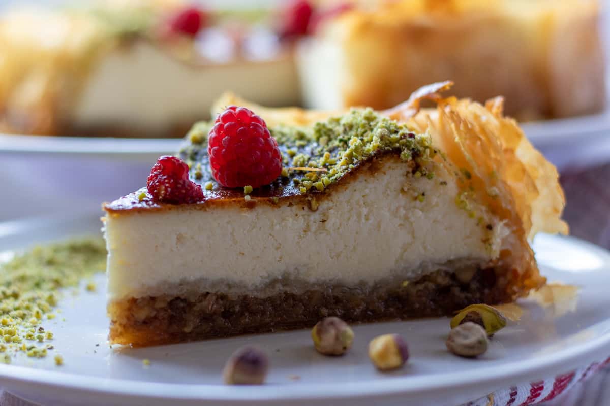 a slice of baklava cheesecake on a plate