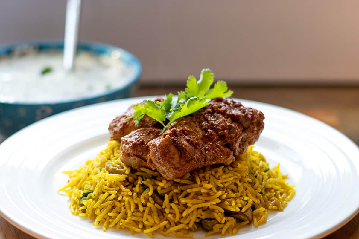 tandoori chicken is served on a bed of oil rice