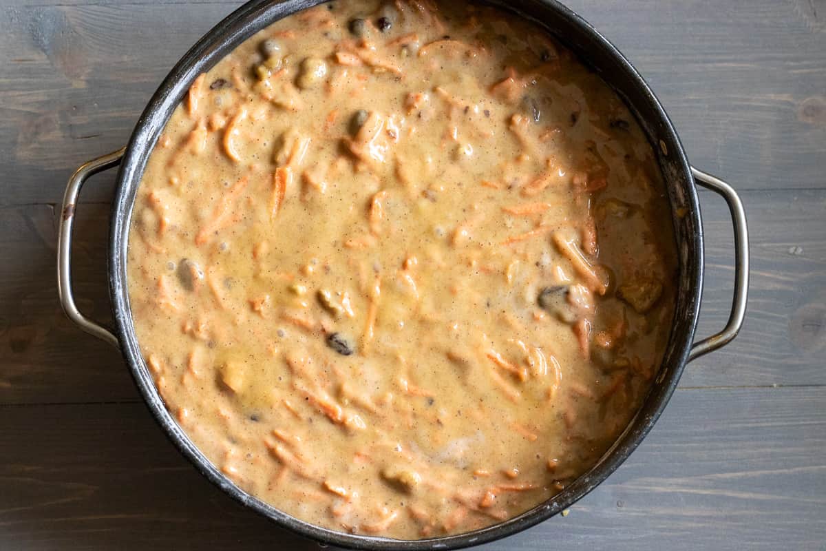 easy carrot cake mixture is pored in a cake tin