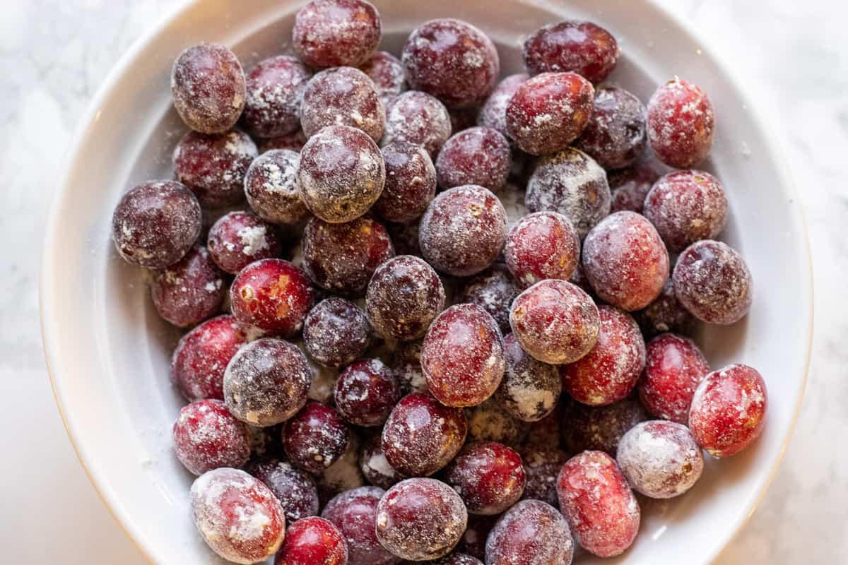 fresh cranberries are covered with flour