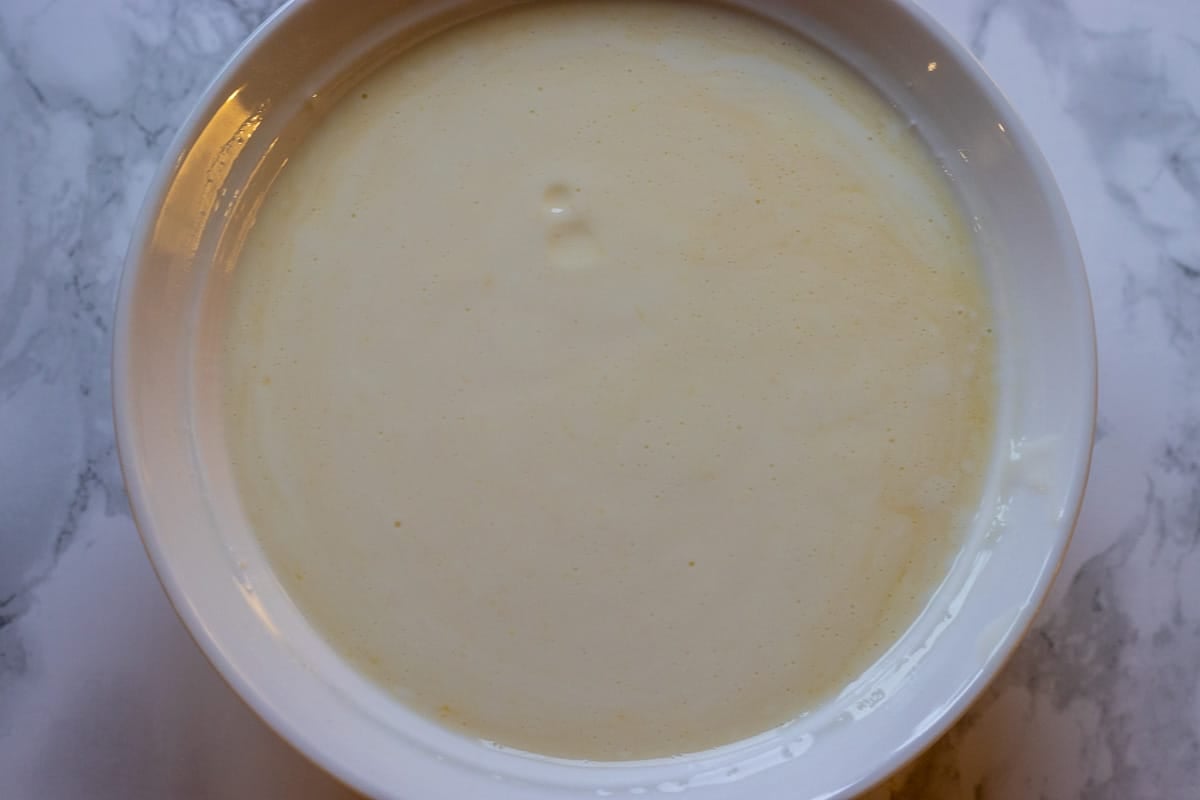 buttermilk and orange juice are mixed in a bowl