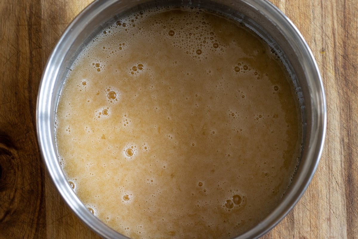 lightly beaten eggs are added to melted honey mixture