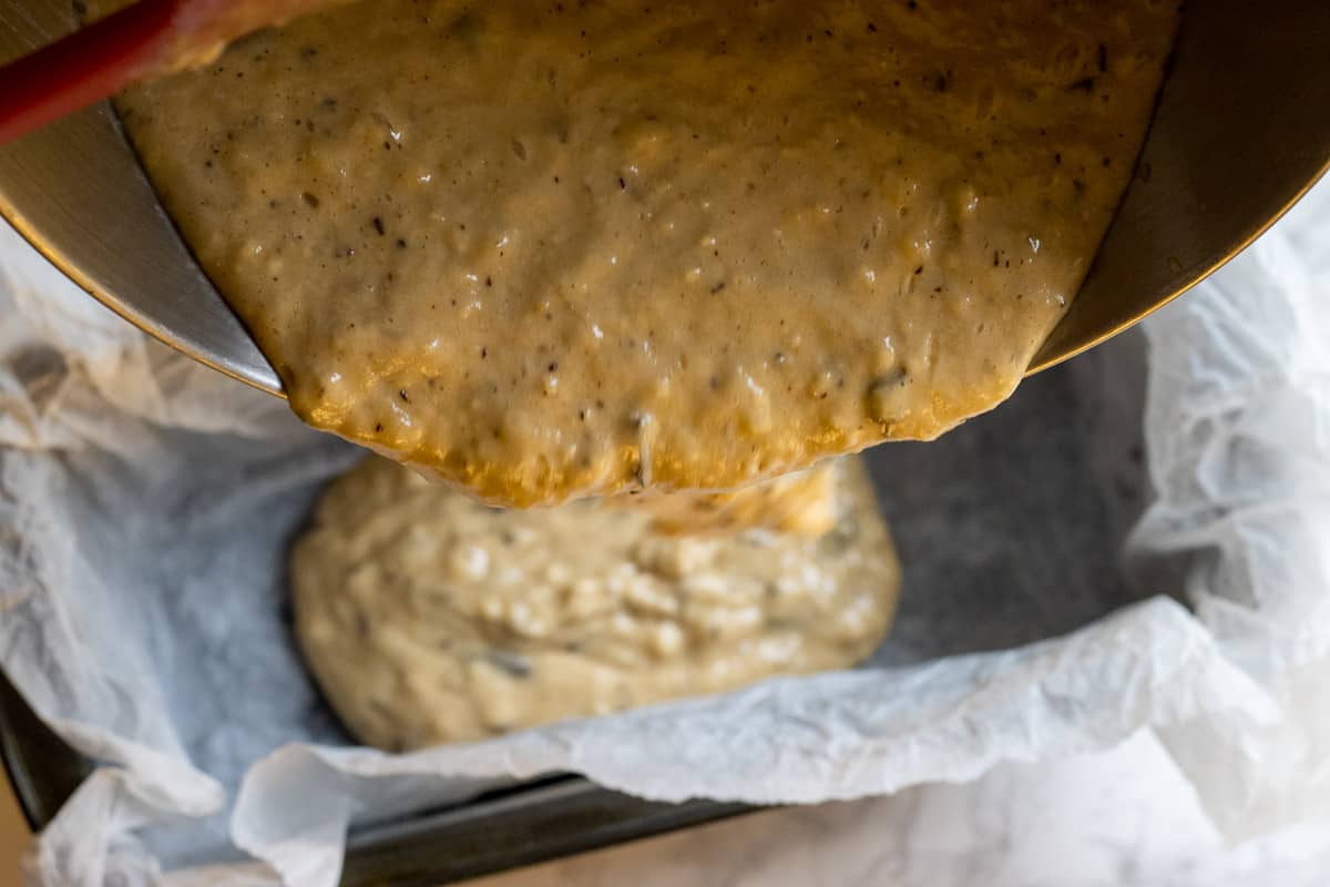 pouring the mixture into a loaf pan