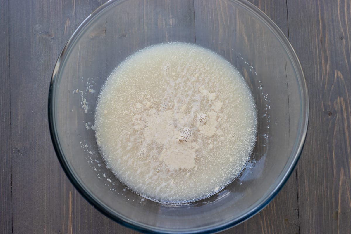 sugar, water and yeast are placed in a glass bowl