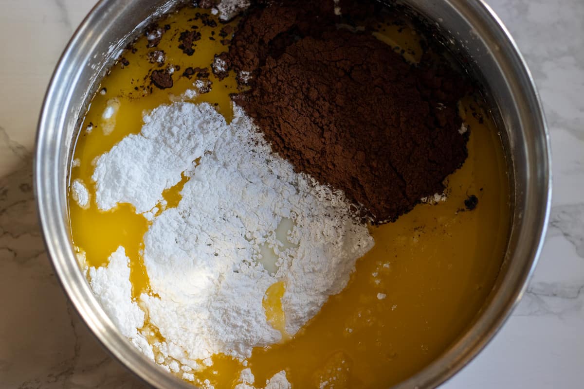 milk, butter, sugar and cacao powder are placed in a pan
