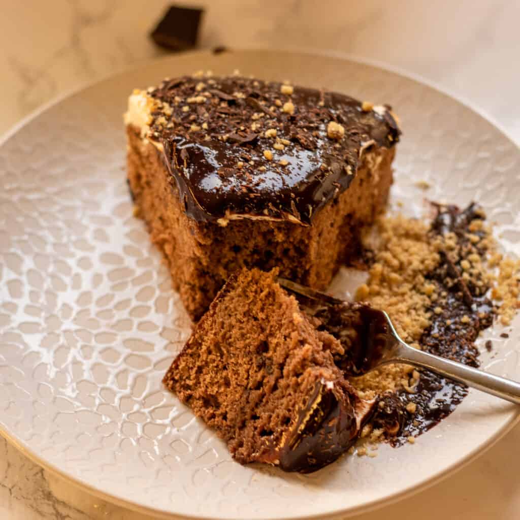 A slice of moist chocolate cream cake