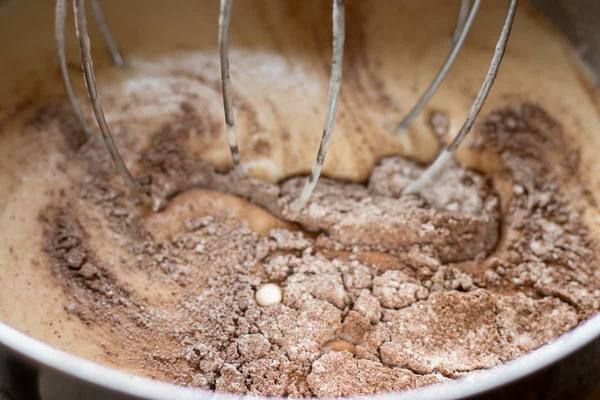 The flour, cacao powder and salt is added to the egg mixture