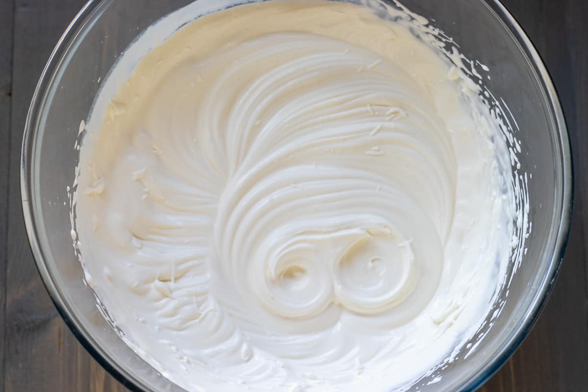 creme Chantilly in a bowl, ready for decorating the cake