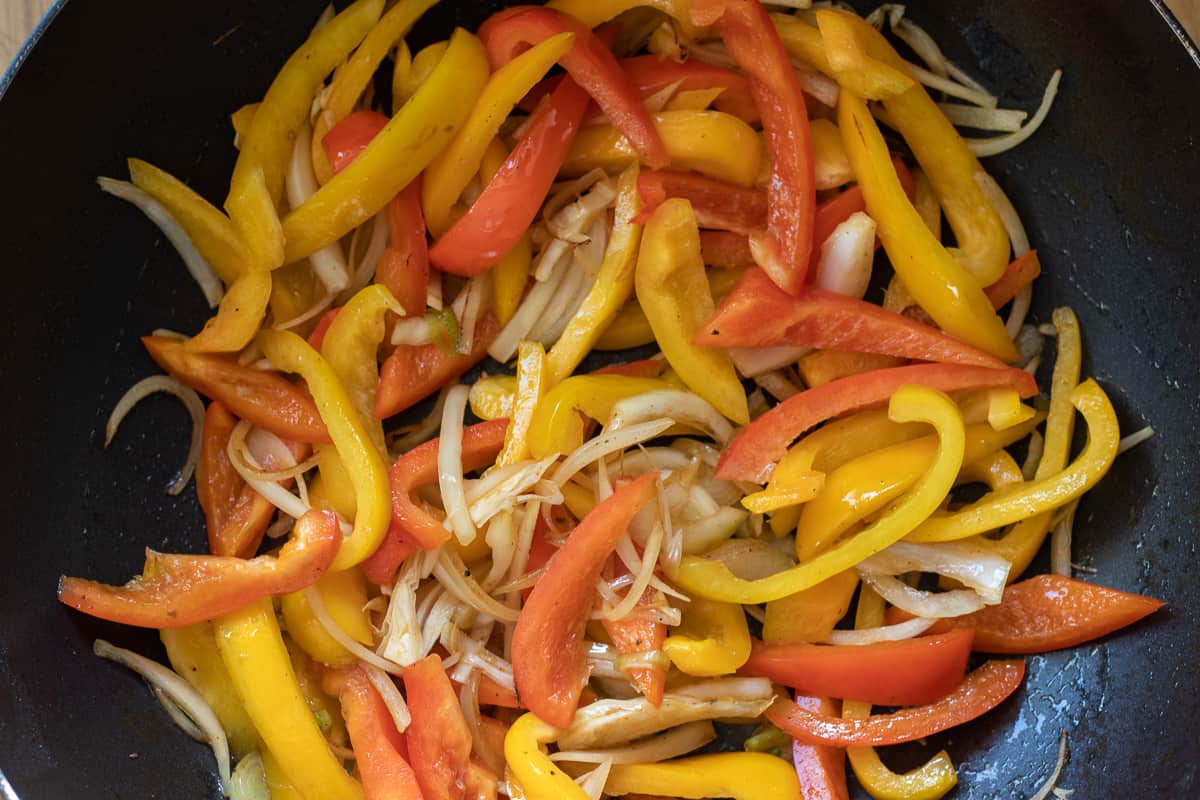 Sautéing the vegetables in a wok